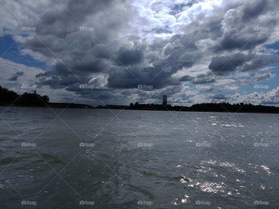 Storm clouds over calm sea