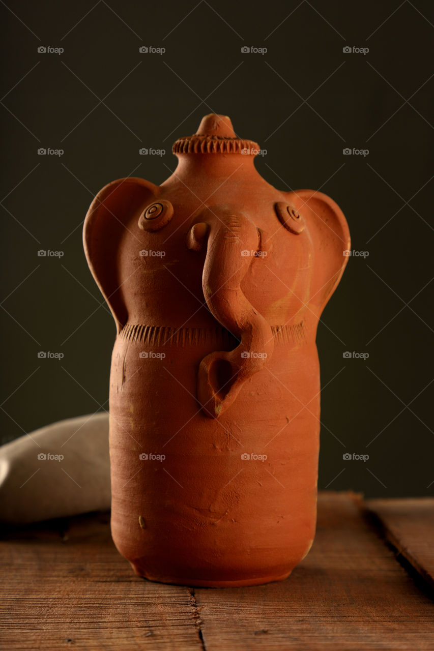 Handmade Hindu lord Ganesha Statue made up of clay pottery item