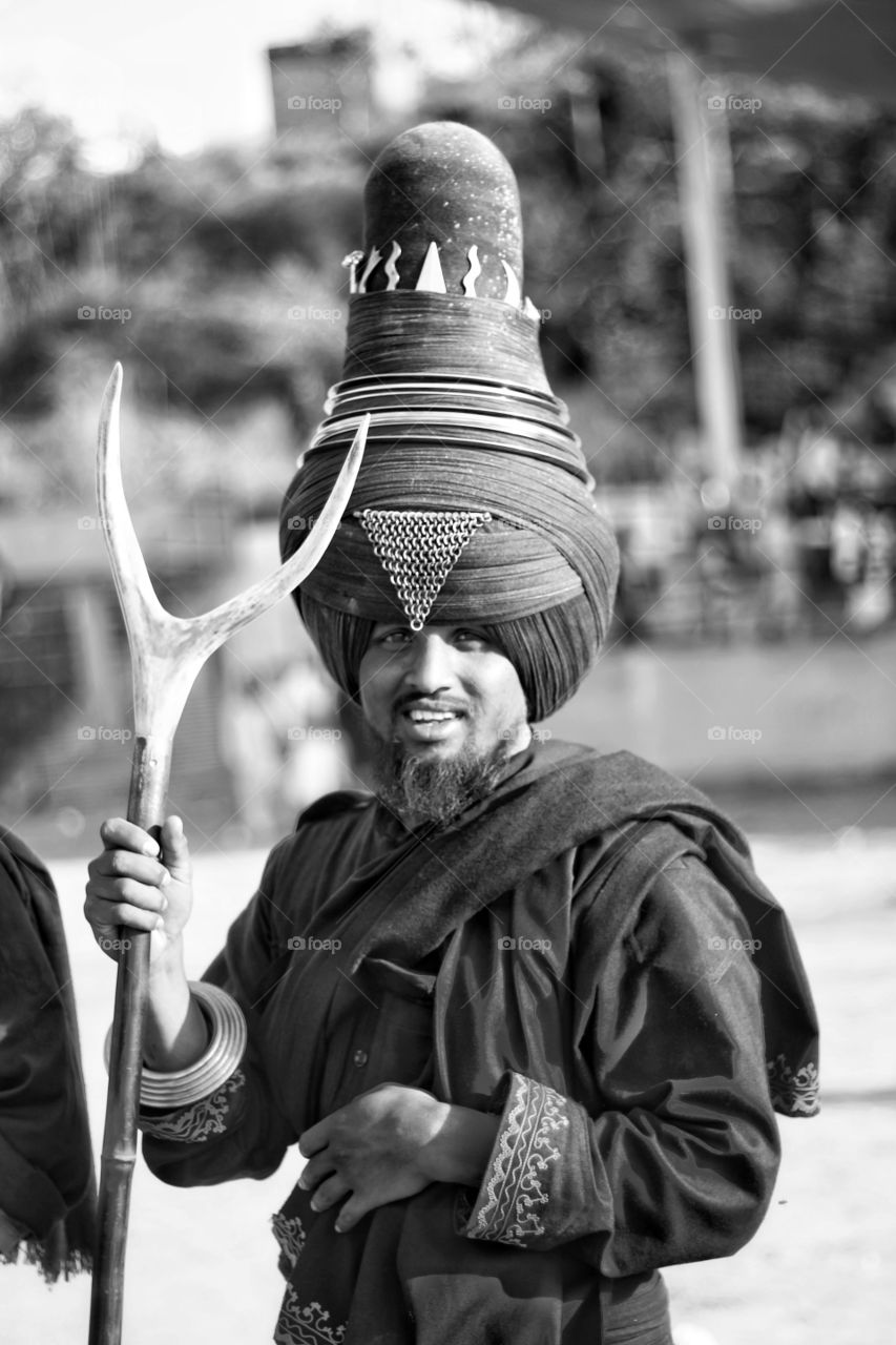 Portrait of a sikh man holding staff