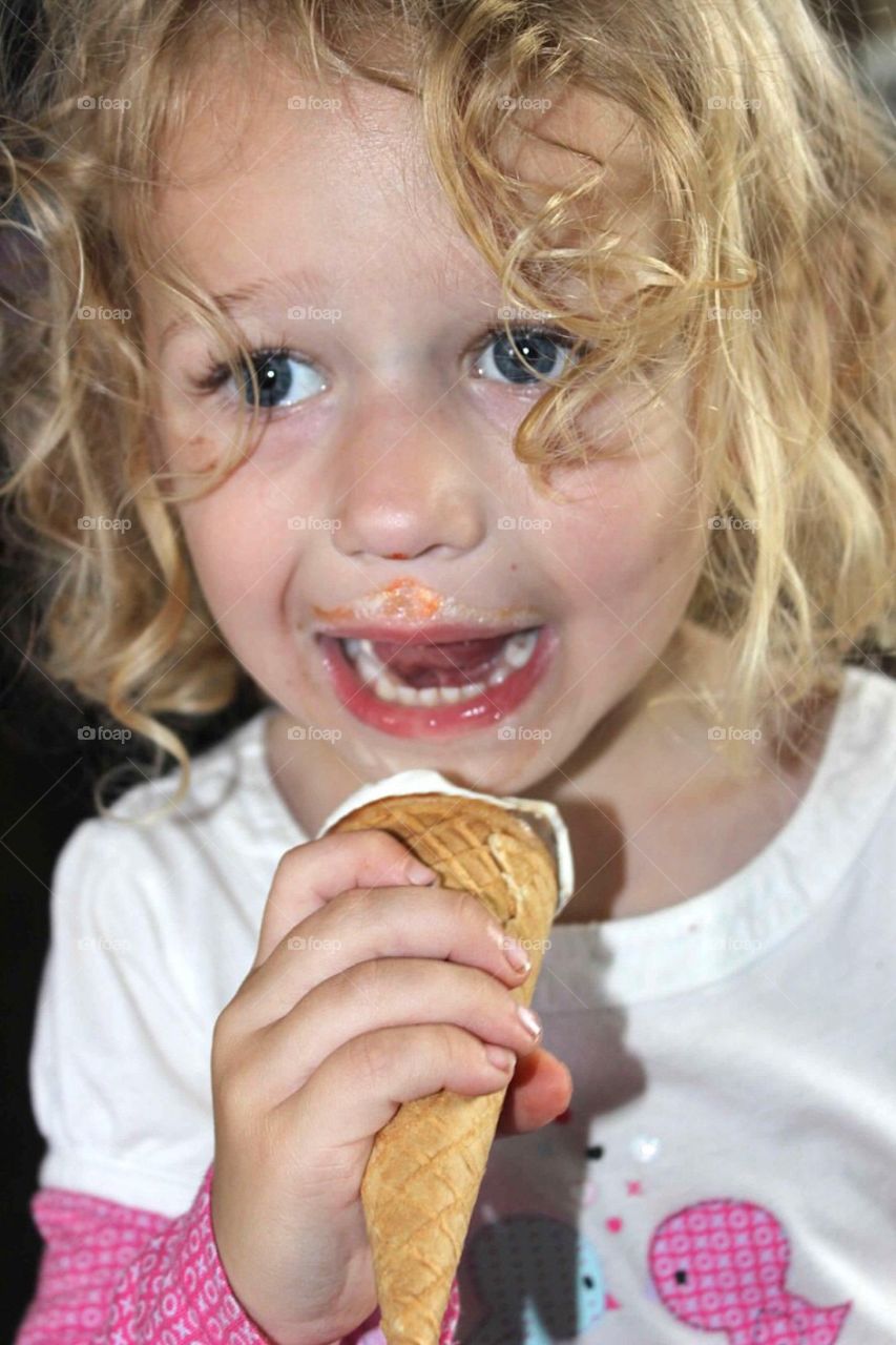 Little girl eating ice cream