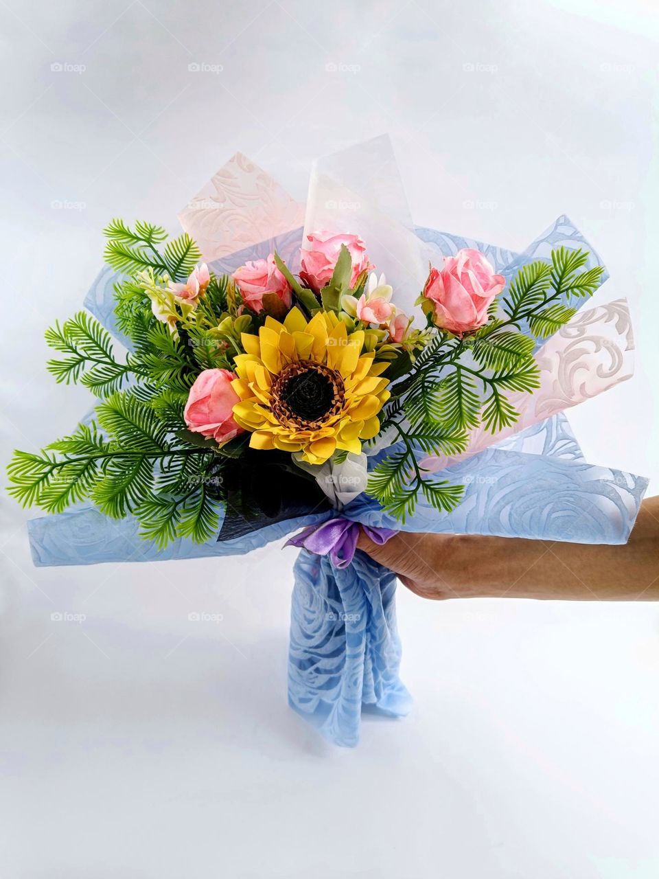a bouquet of artificial flowers.