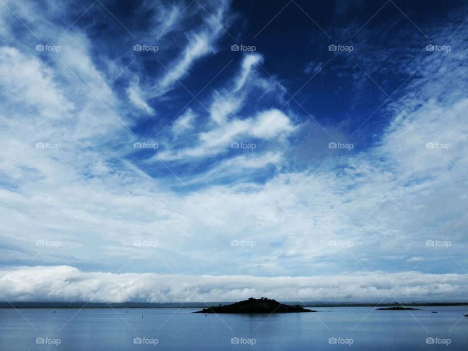 What a majestic view. Nature talk to you in many ways.. Blue and white clouds combination and island in the reservoir touches your heart like no other. Thanks be to the creator.