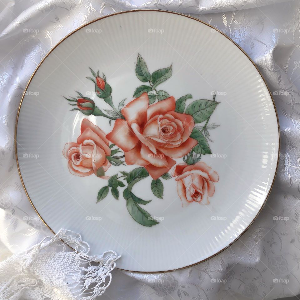 Antique porcelain dish with coral roses 