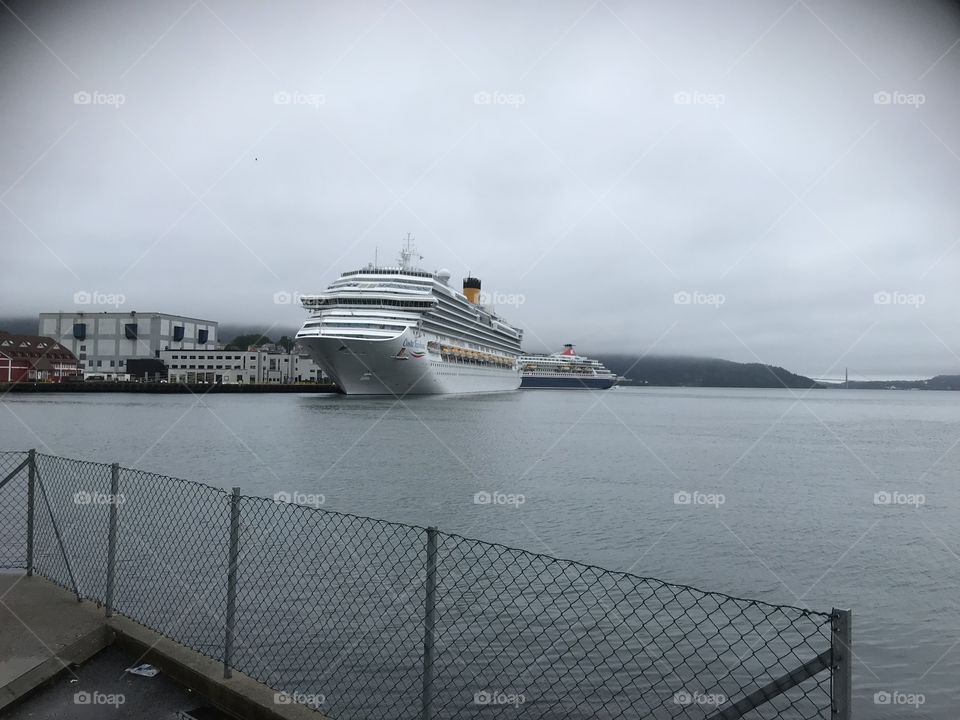 A cruise ship docked in the Norwegian city Bergen. The weather this day were grey, and foggy, which is common for Bergen.