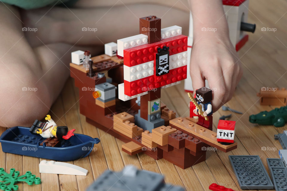 Child playing Lego pirate