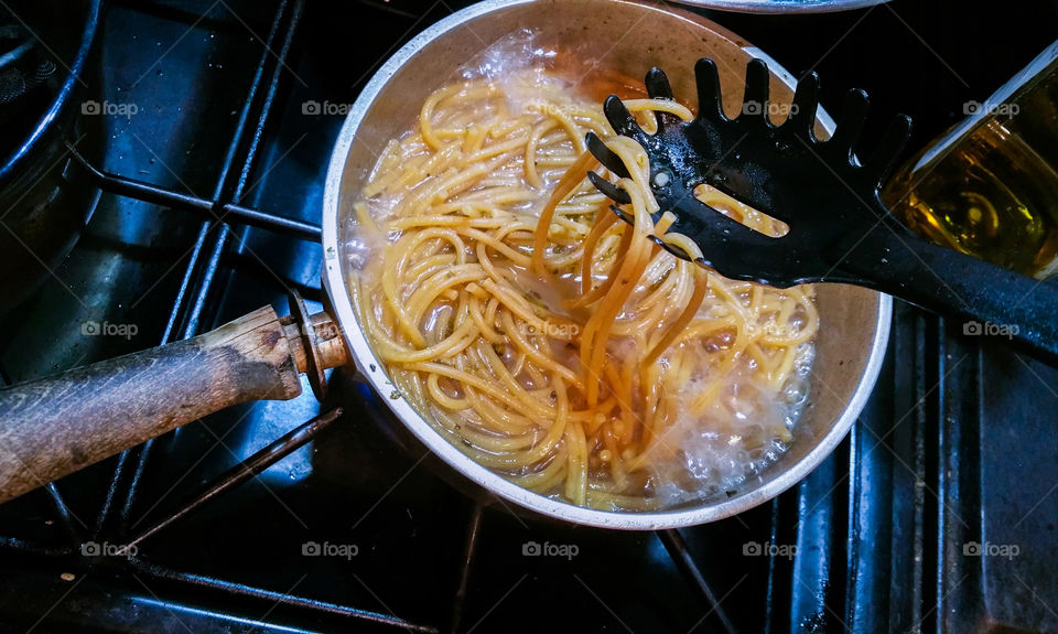 High angle view of noodles cooking