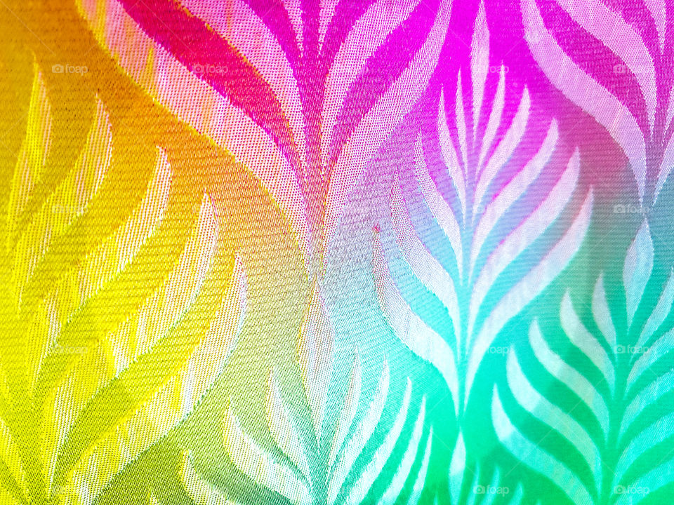 Texture illuminated by rainbow lights.  Creative background.