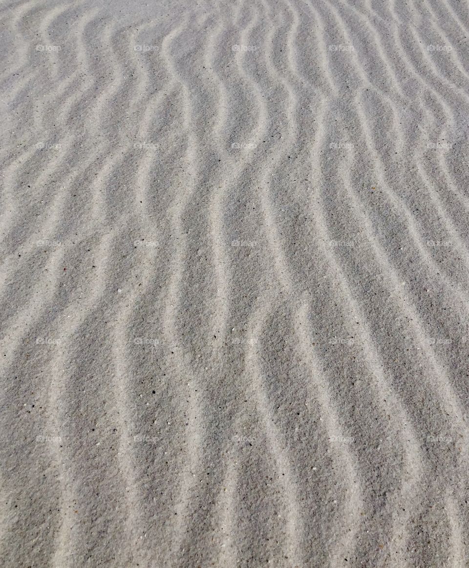 Wind creates patterns in sand