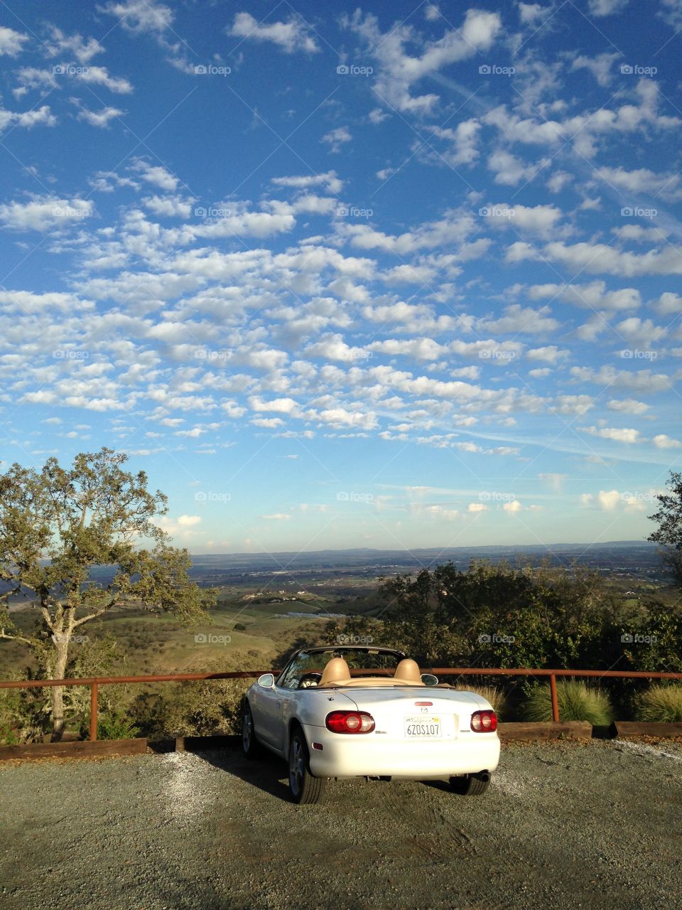 Overlook. Convertible car looking out over a valley
