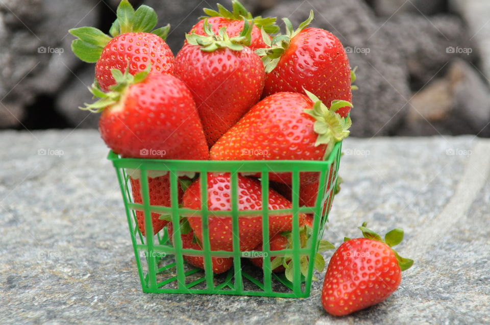 Red strawberries in small basket