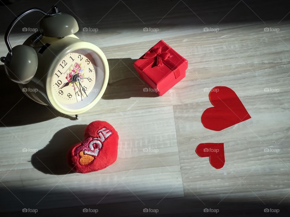 Red color story. Clocks and love hearts