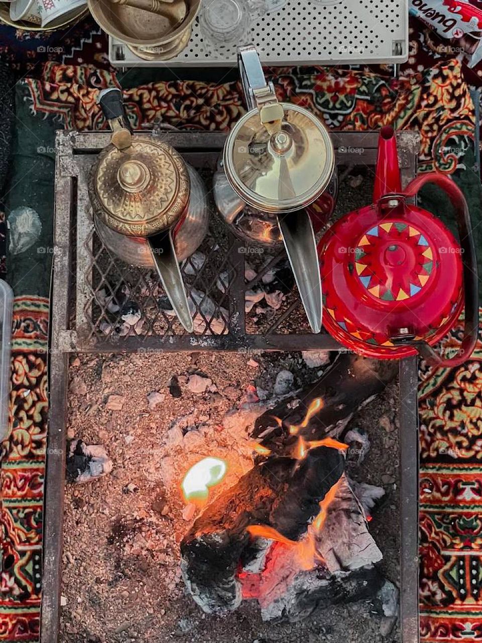 The Arabs' heritage is lighting a fire and preparing Arabic coffee and tea, so that the evening is enjoyable