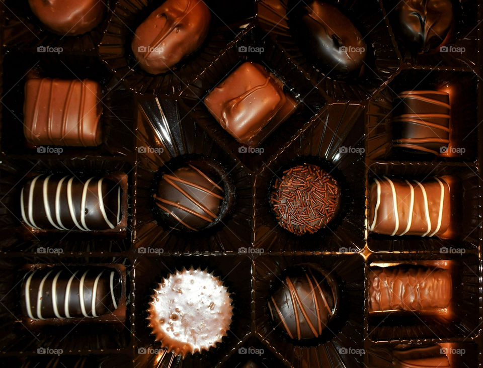 Assorted Gourmet Chocolates In A Box Closeup View