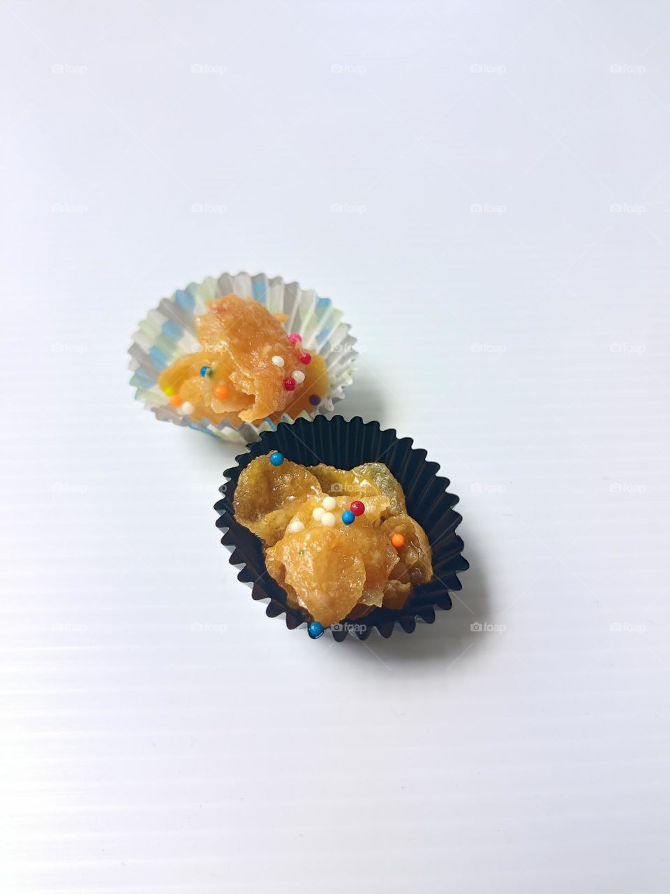 Honey corn flakes cookies on white background.45 degree above close view
of honey corn flakes during Hari raya Aidifitri celebrations.Honey Joys or called biskut cornflakes madu photo.