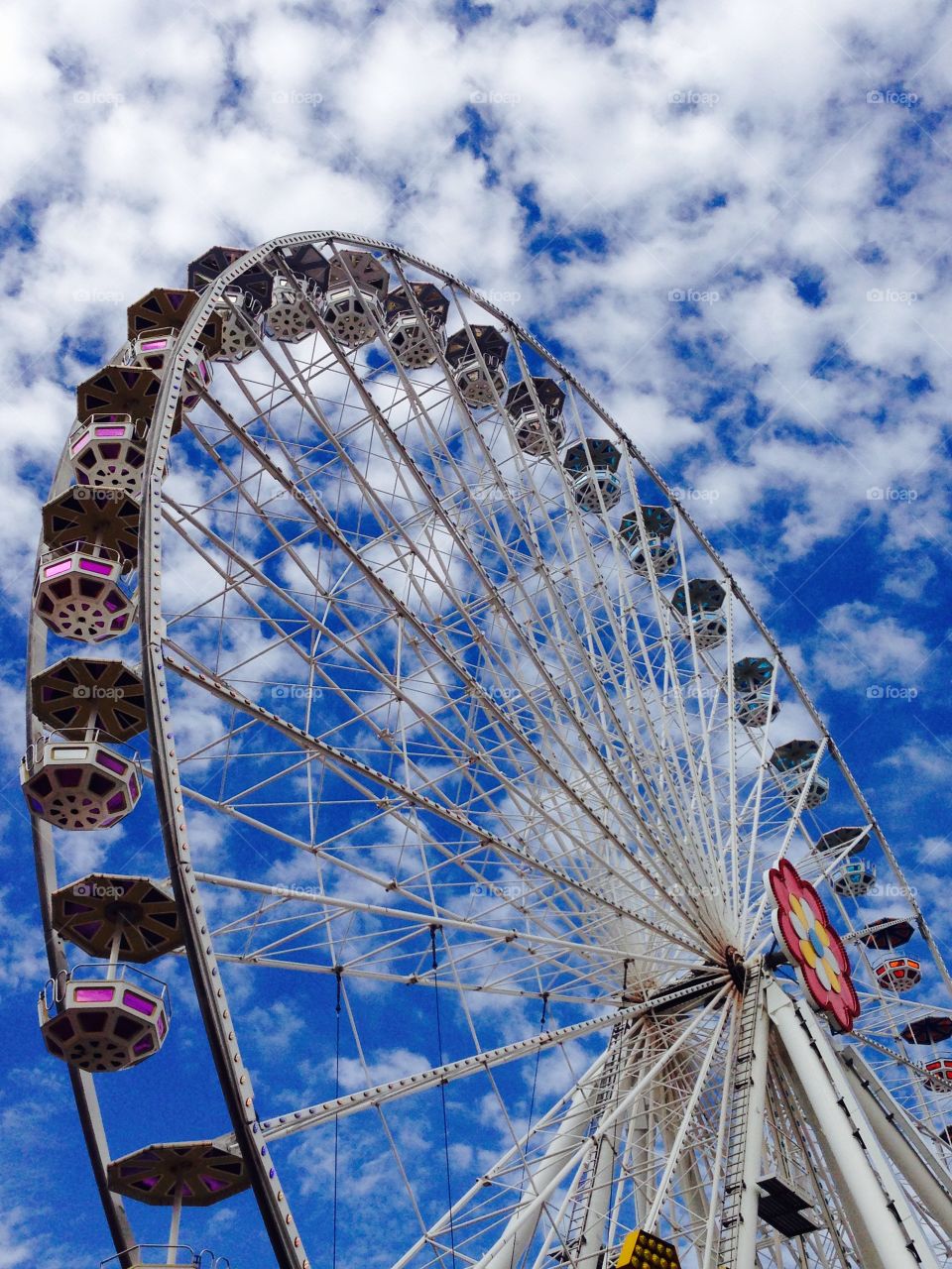 ferris wheel in amusement park. ferris wheel in amusement park with sky clouds background 