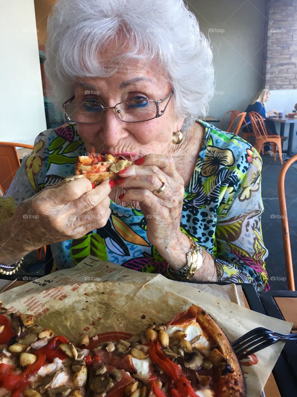 Great grandma eating pizza