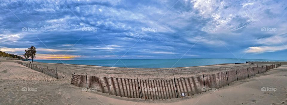 On a blustery beach in Michigan, beaches in the offseason, enjoying the quiet beach seclusion 