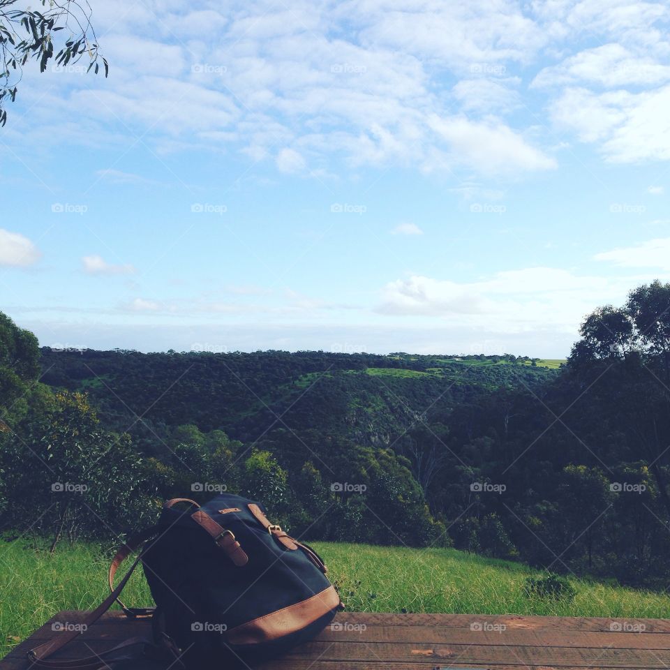 Rolling hills and clear blue skies are revealed just beyond the beaten path at Onkaparinga park in South Australia 