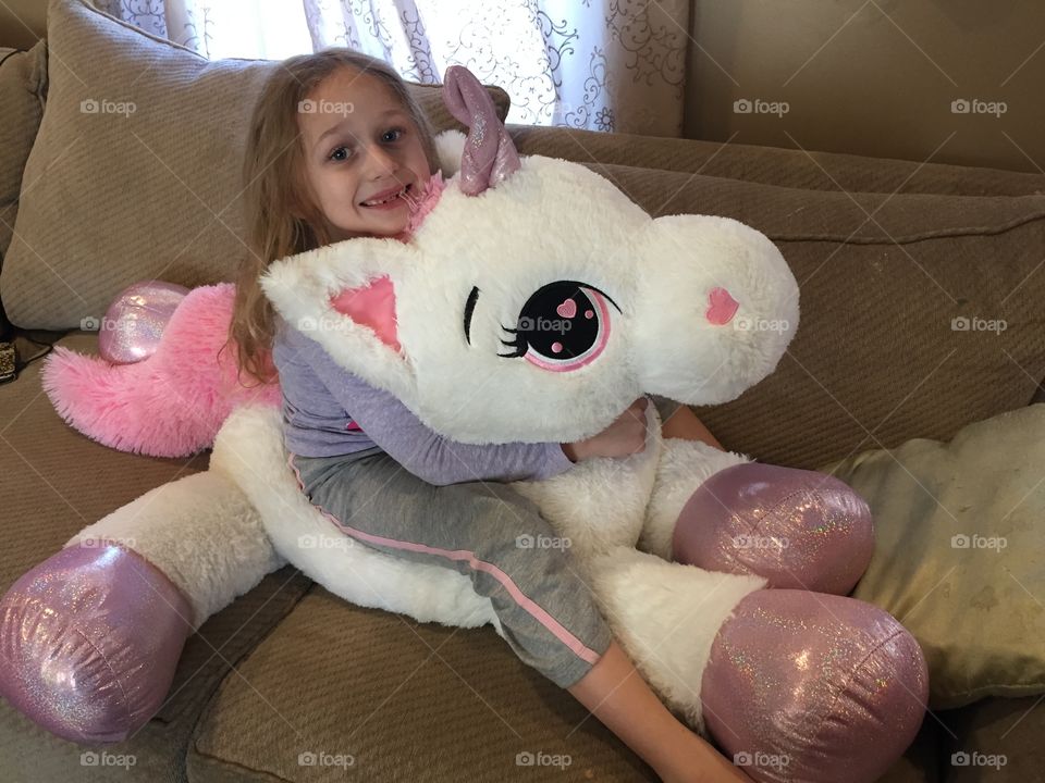Girl playing with soft toy