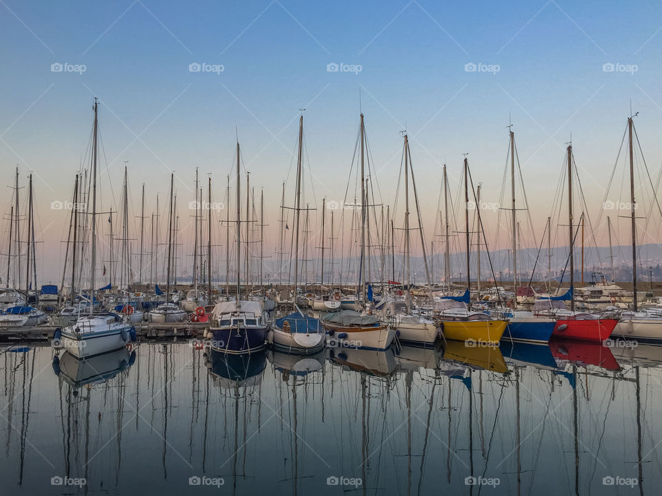 Sailboat moored at harbor