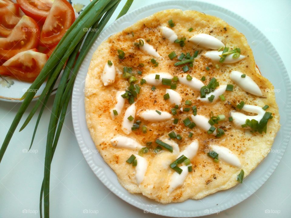 Eggs with green onion and tomatoes