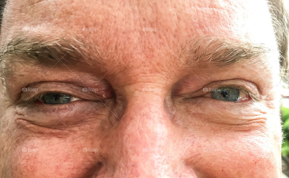 Closeup man's face: eyes and nose; middle age