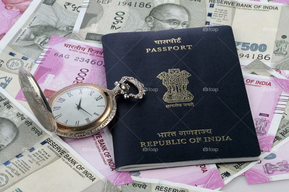 Indian Passport with antique watch and money