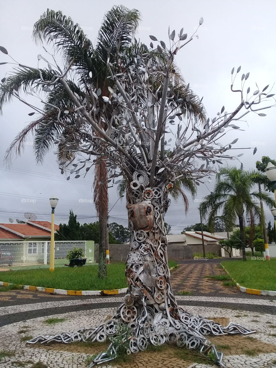 Tree made with recyclable material.  Using bycicle handlebars,parts of car etc.