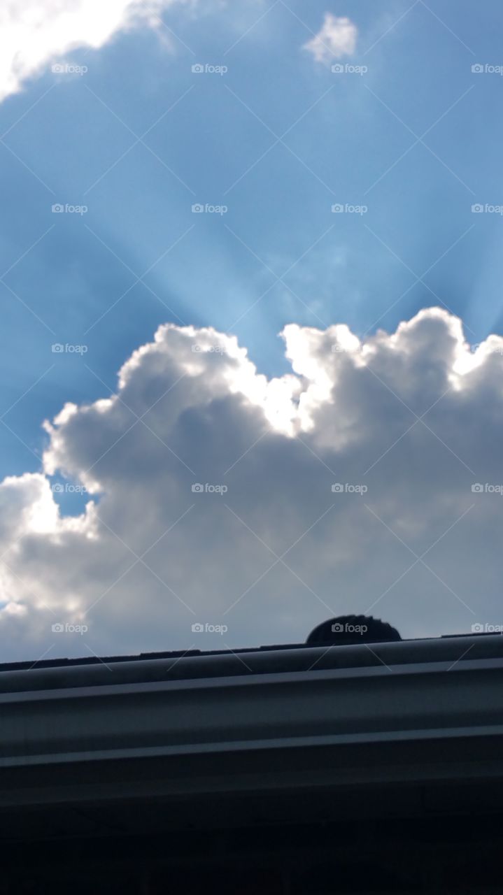 sunbeams. clouds passing over the sun