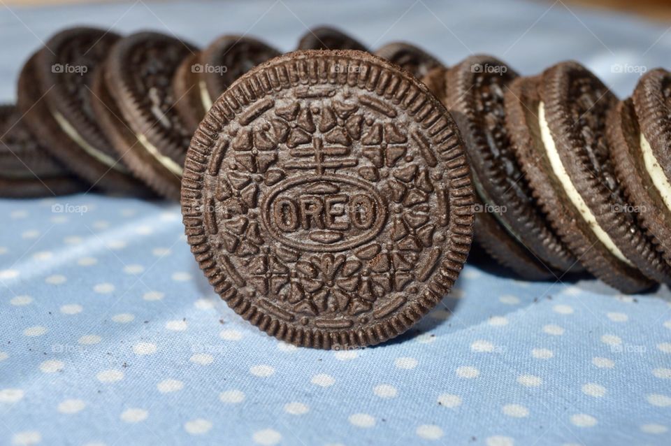 Oreo cookies on a Polk dot blue background 