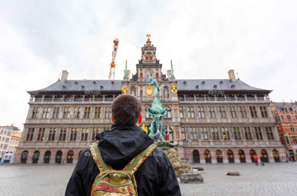 traveler in front of Antwerp city hall