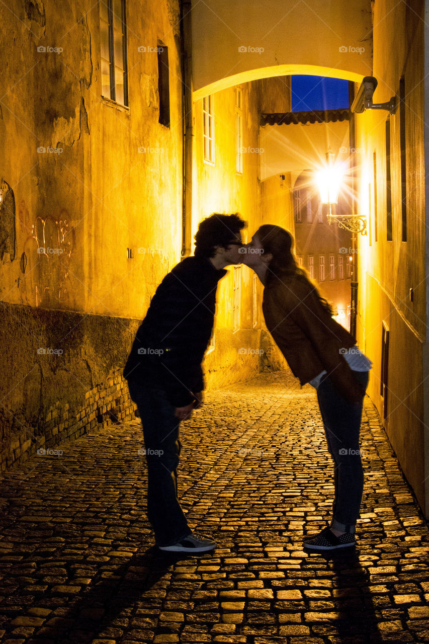 Couple kissing at night