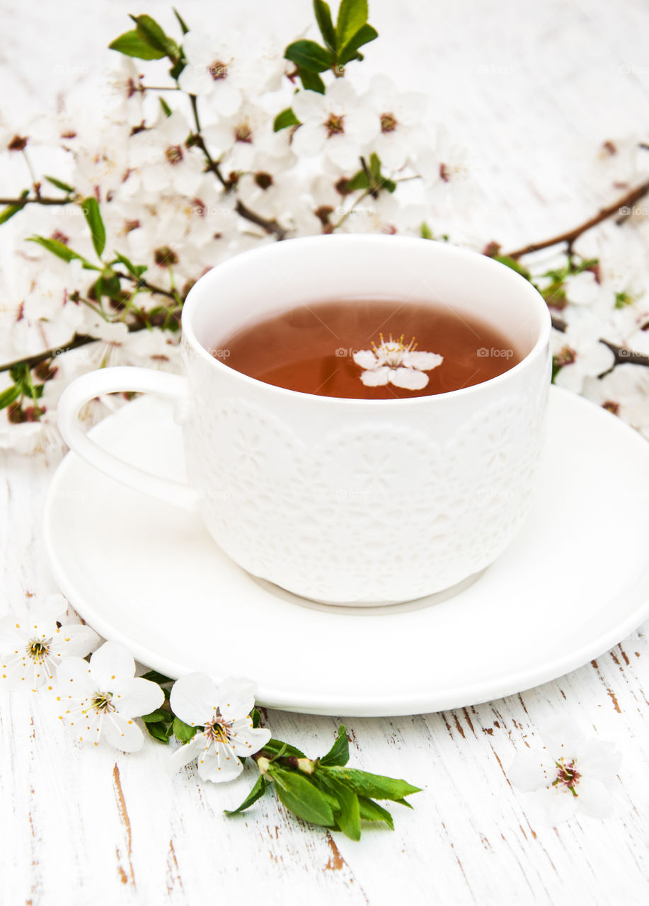 Cup of tea and spring blossom 