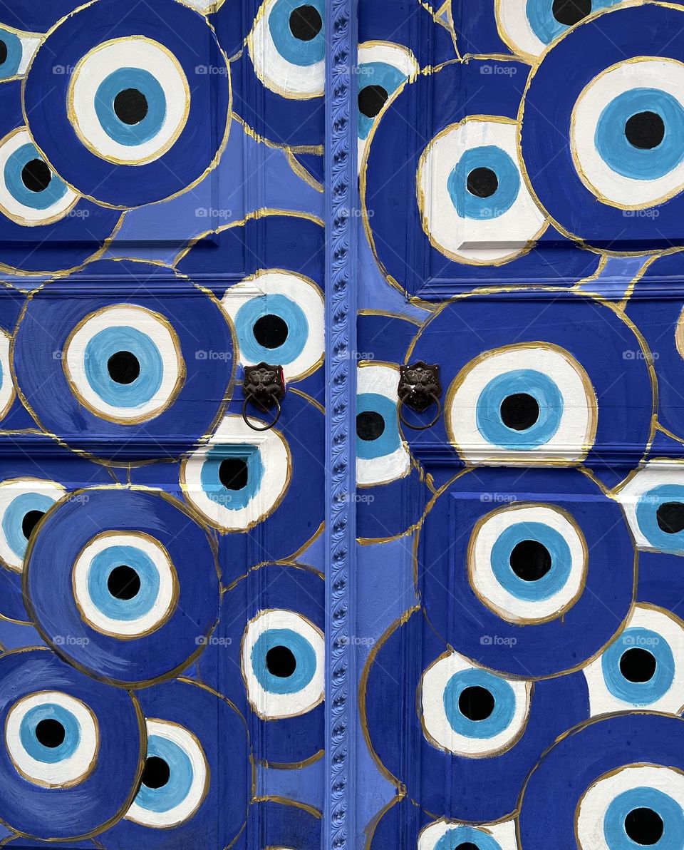 Colourful doors. Beautiful authentic wood doors with blue ornaments. 