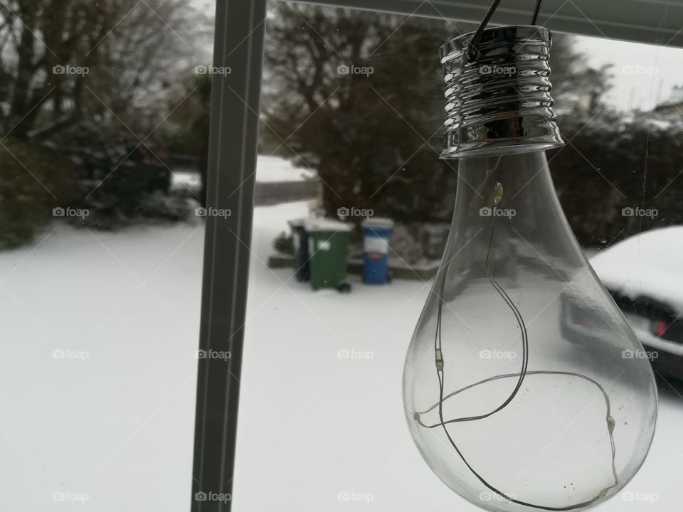Light bulb on a snowy day