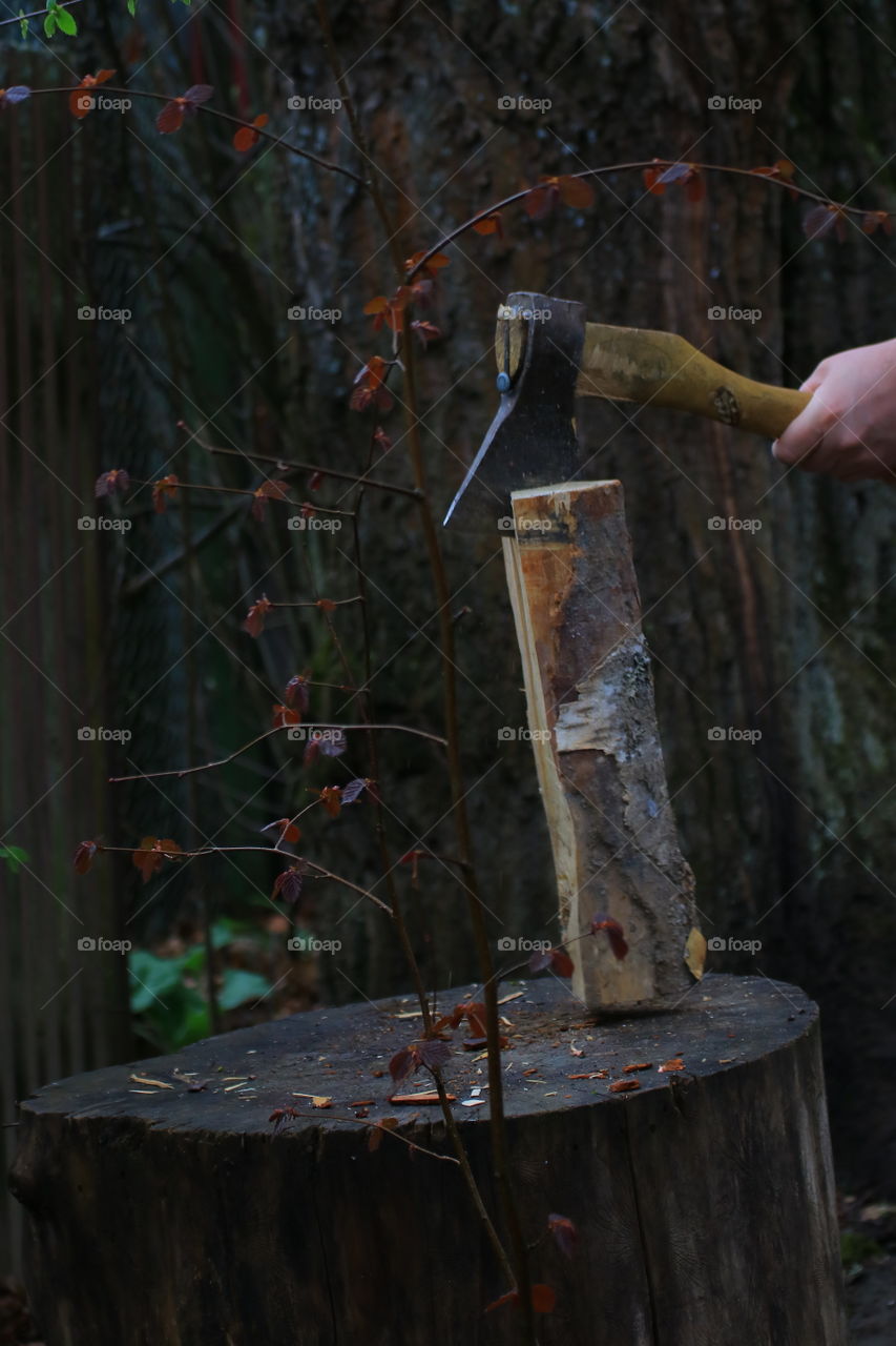 Ax.  Village.  Chop wood.  Country life.  Man's hands.