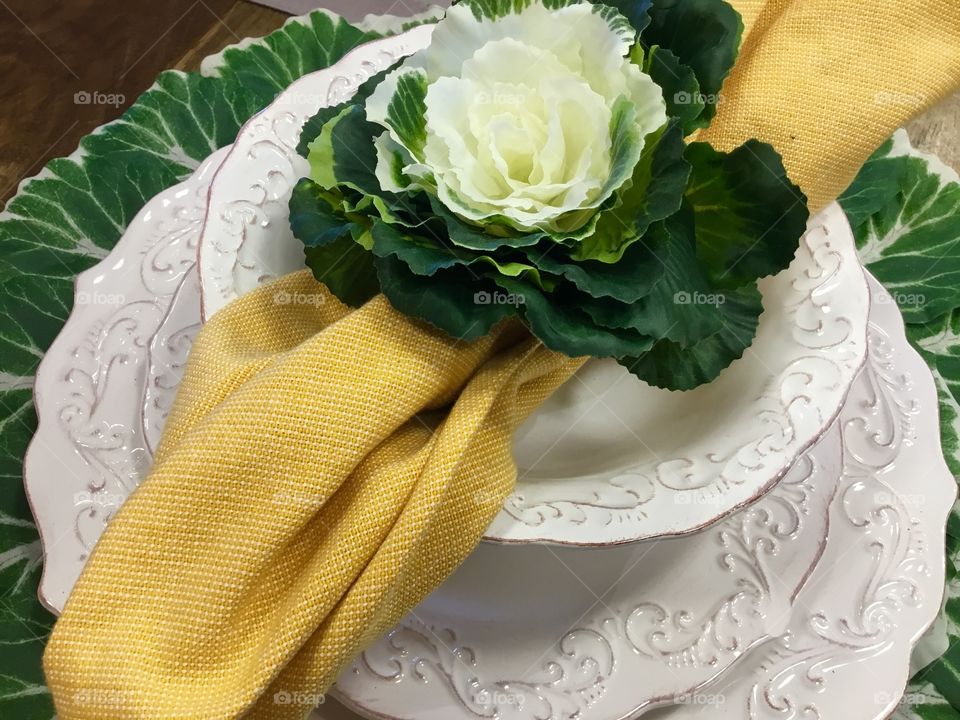A beautiful and fresh Easter place setting, ready for springtime and holiday guests.