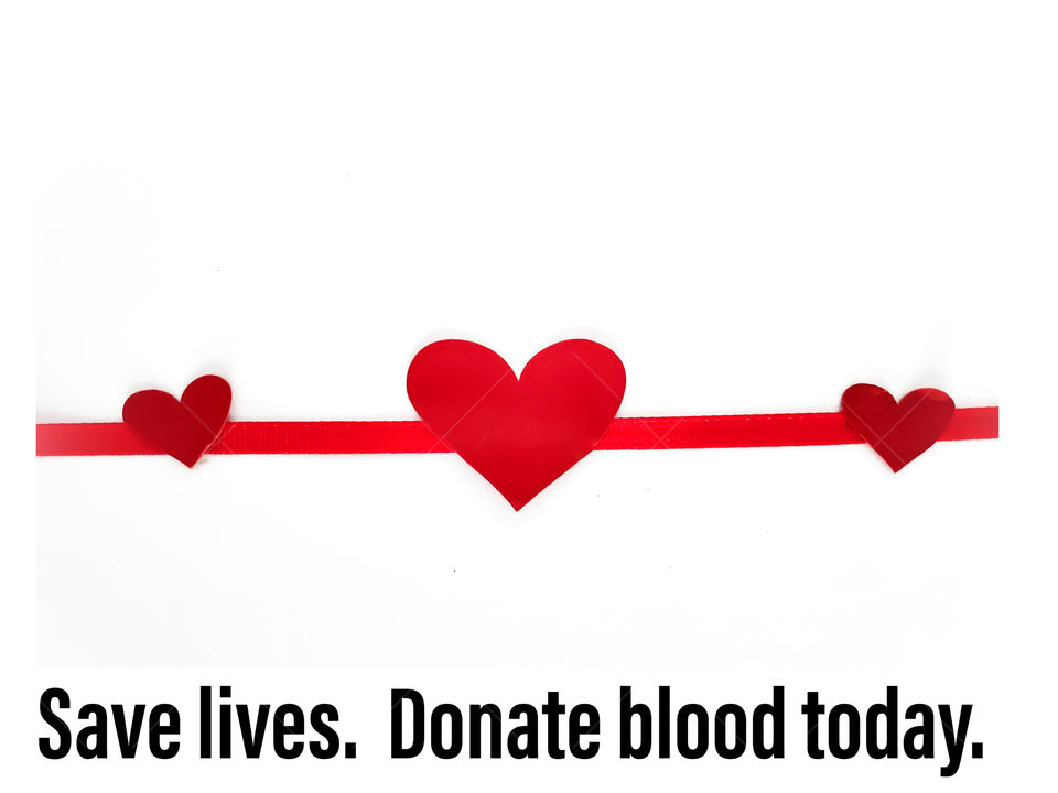 Flatlay: Three red hearts connected by a red ribbon on a white background with Black text:  Save lives. Donate blood today.