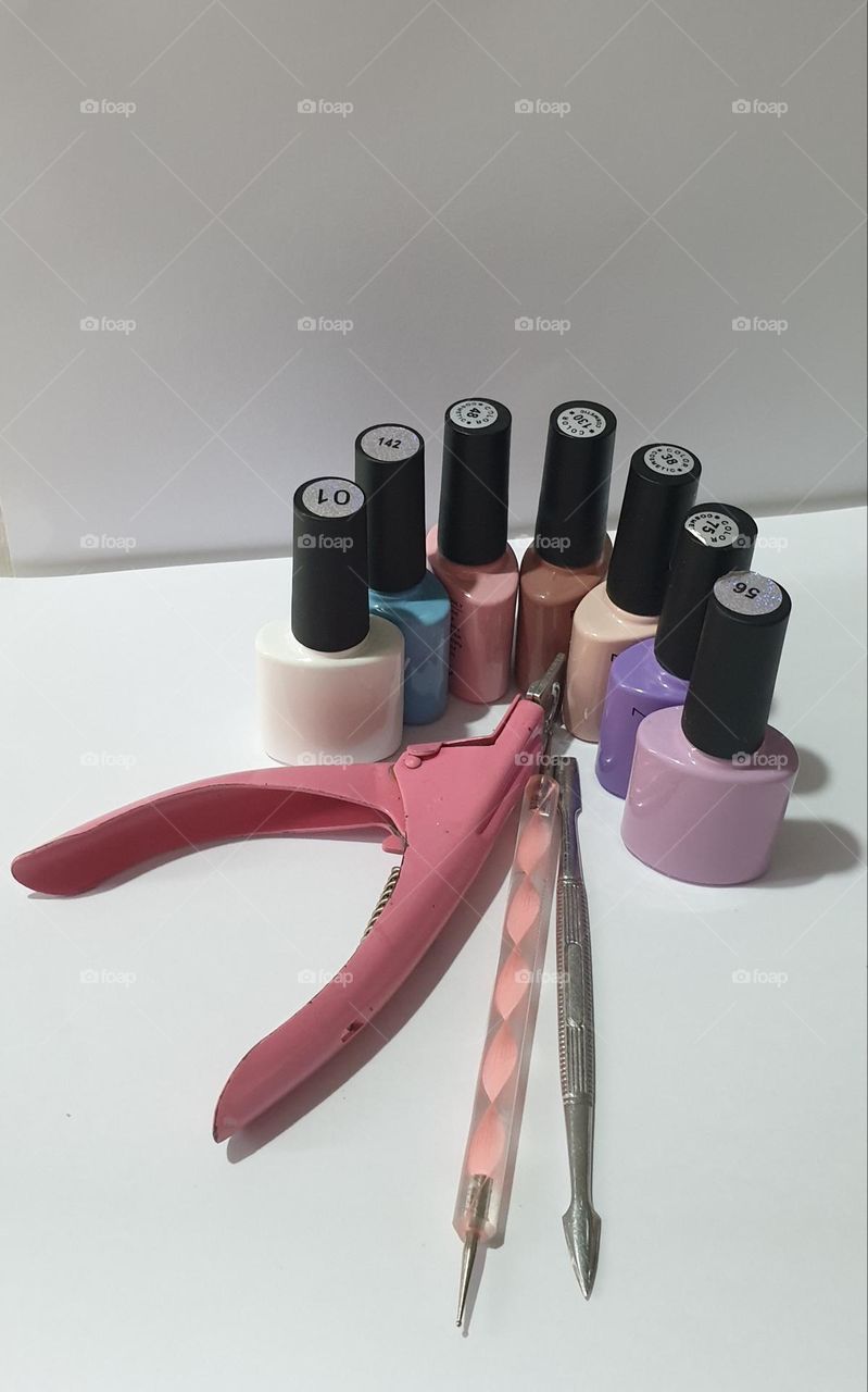 simple design with beauty implements for nails, pastel colors and work implements