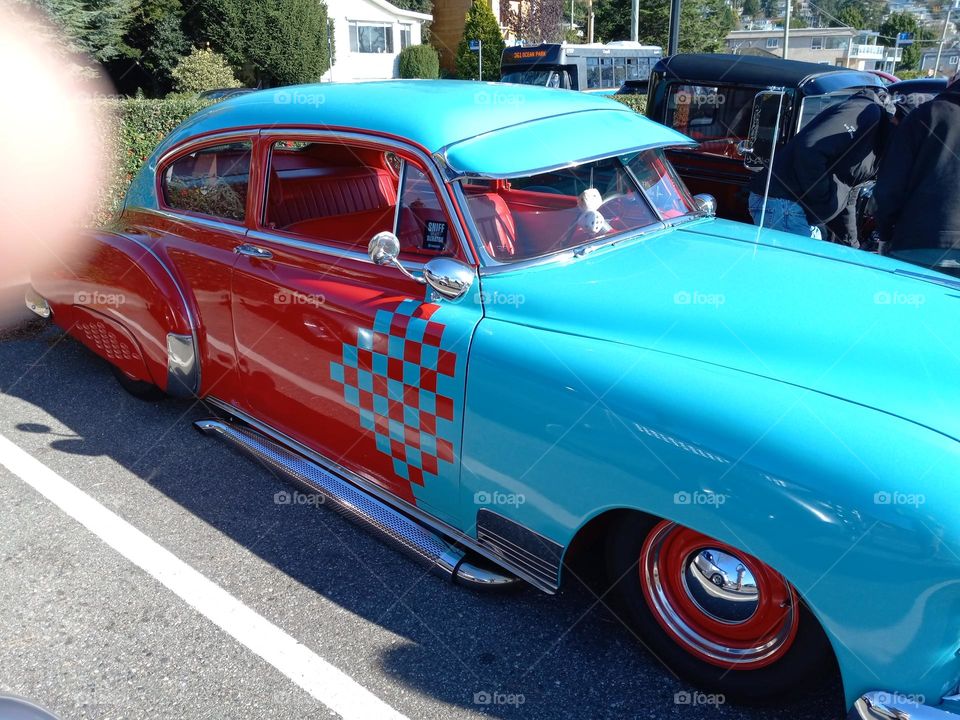 Vintage Cadillac with a Red and Turquoise checkered pattern 