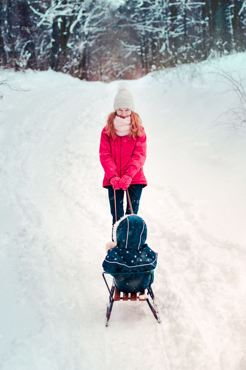 Winter with friends. Spending wintertime outdoors playing with snow