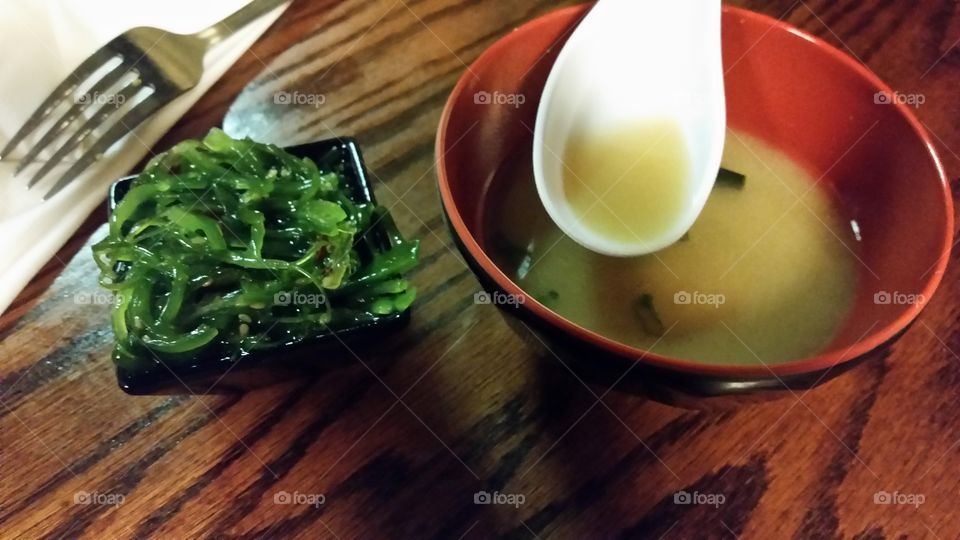 miso soup with salad. miso soup with a refreshing seaweed salad