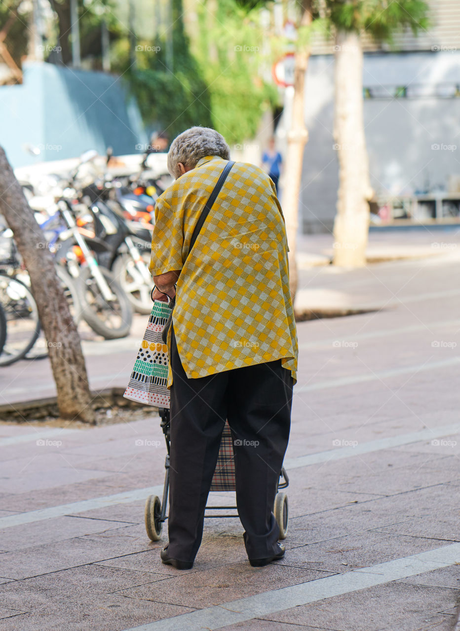 Elderly woman going shopping