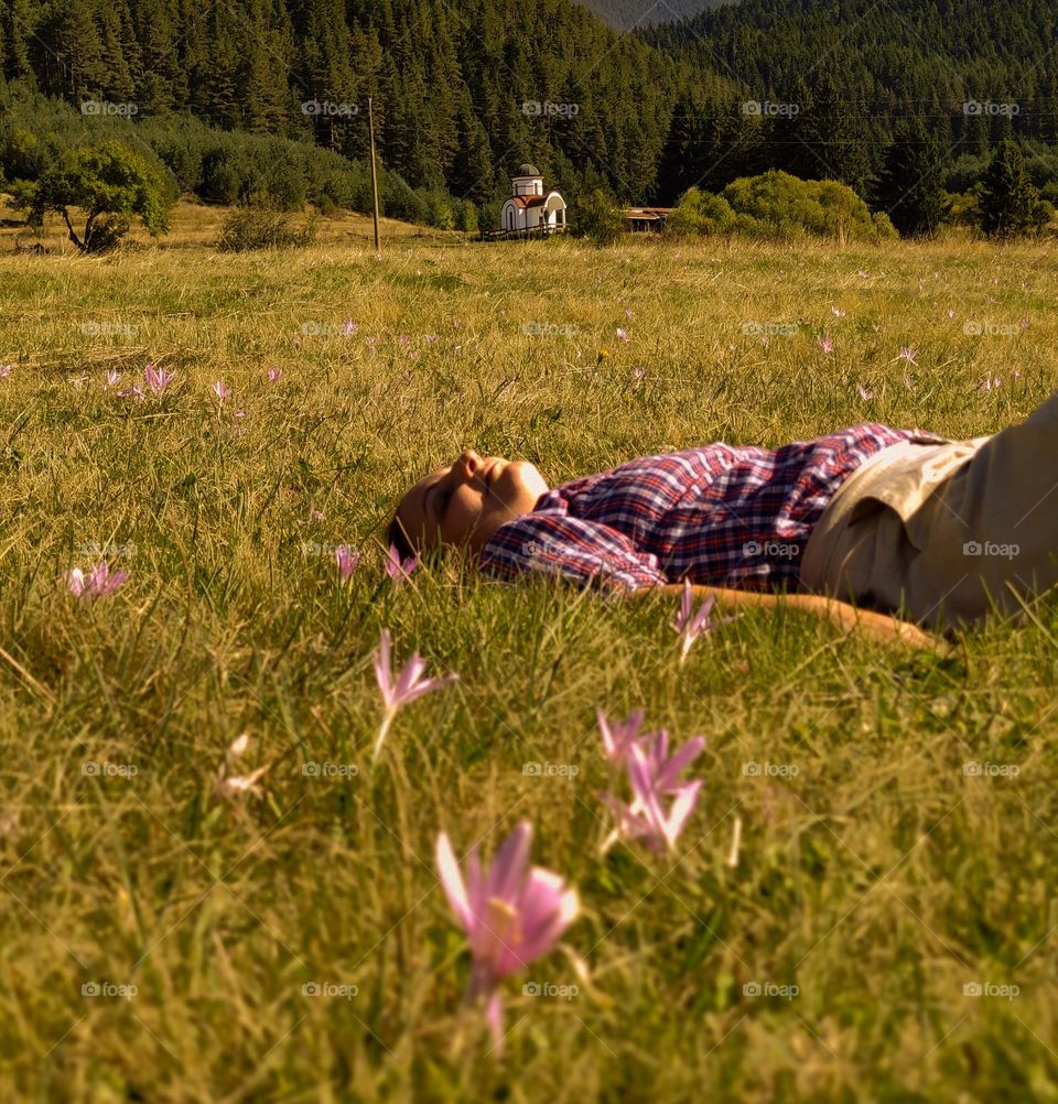 Relax on a spring meadow after intensive hiking
