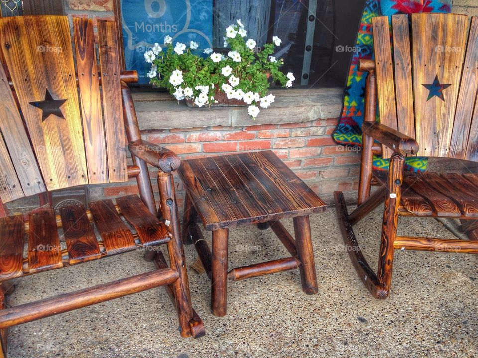 Relaxation time. Rustic outdoor chairs and table