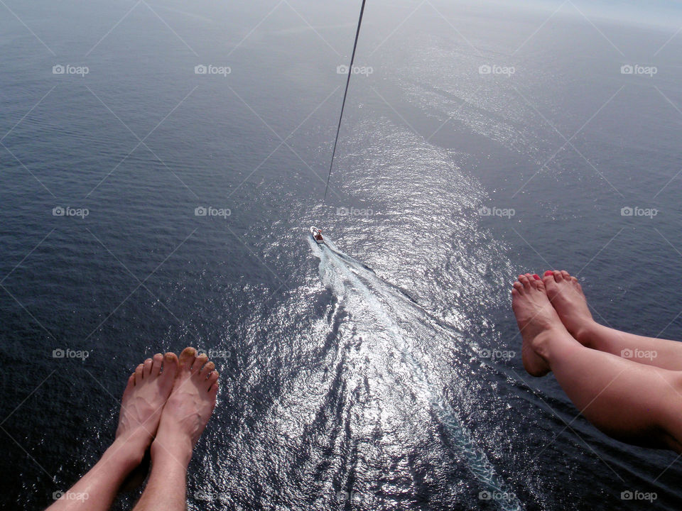 Swinging over paradise. Parasailing over Cabo San Lucas harbor.