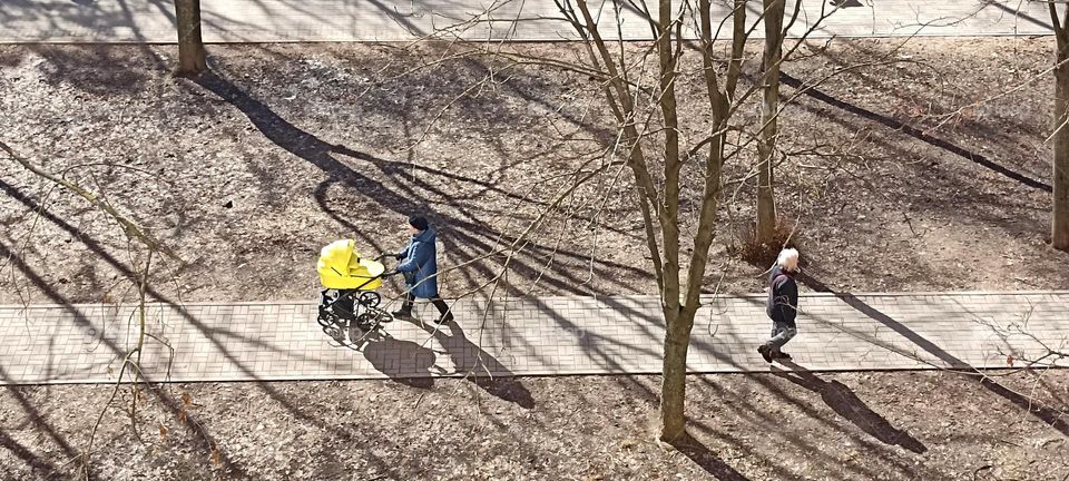 street view people walking in sunlight and shadows park, top view