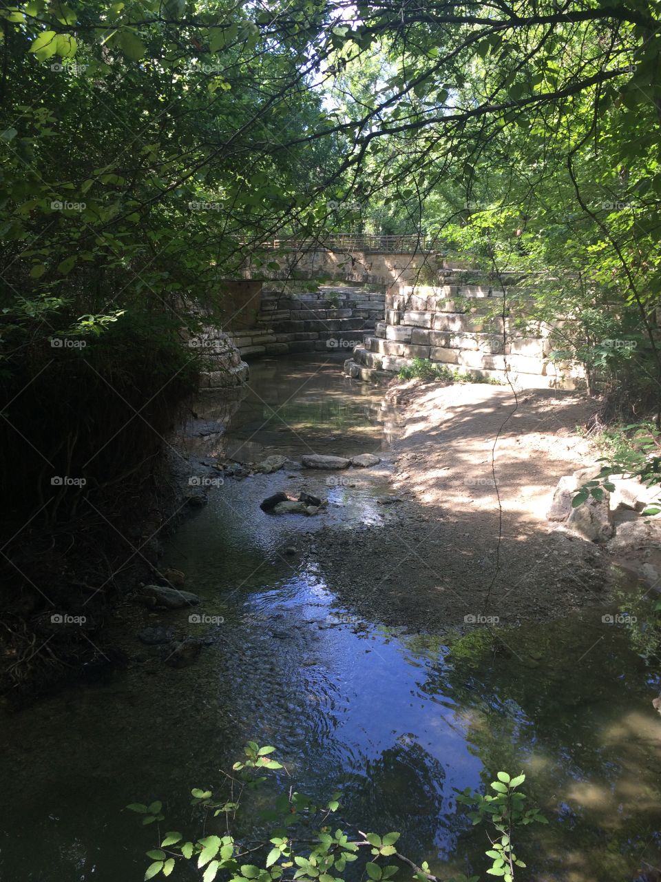 A river runs beneath a bridge.