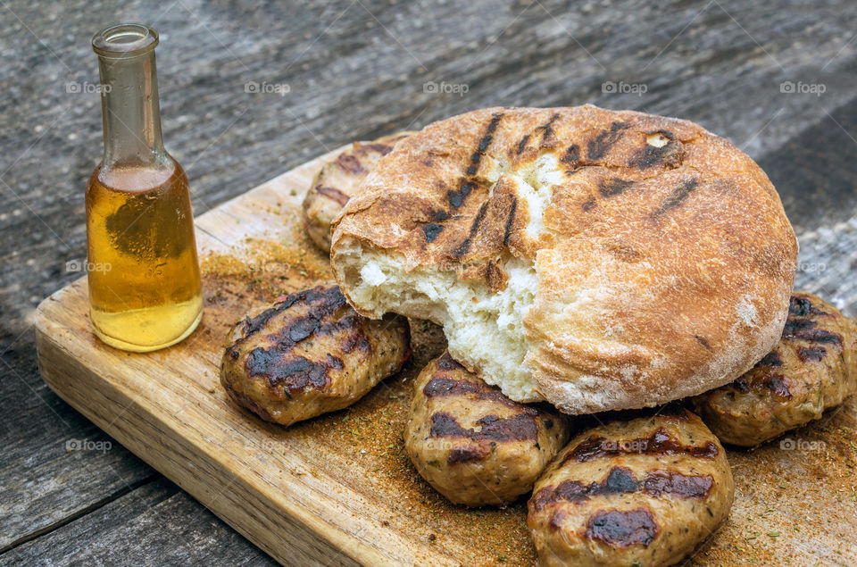Delicious meatballs on a wooden board