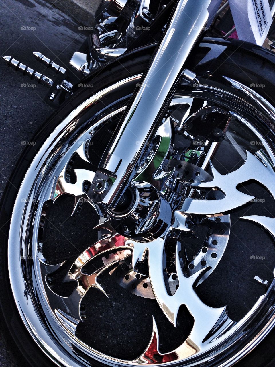 Take a ride with me. Wheel of a chopper motorcycle